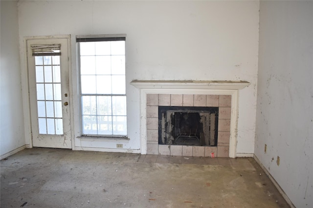 unfurnished living room featuring a fireplace