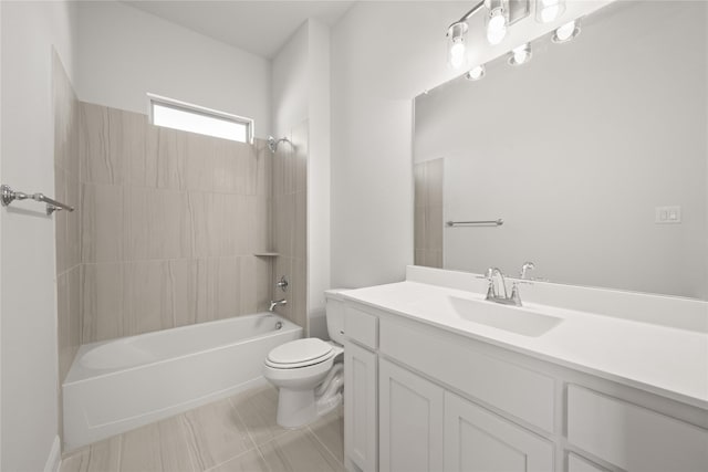 full bathroom featuring toilet, tile patterned floors, bathing tub / shower combination, and vanity