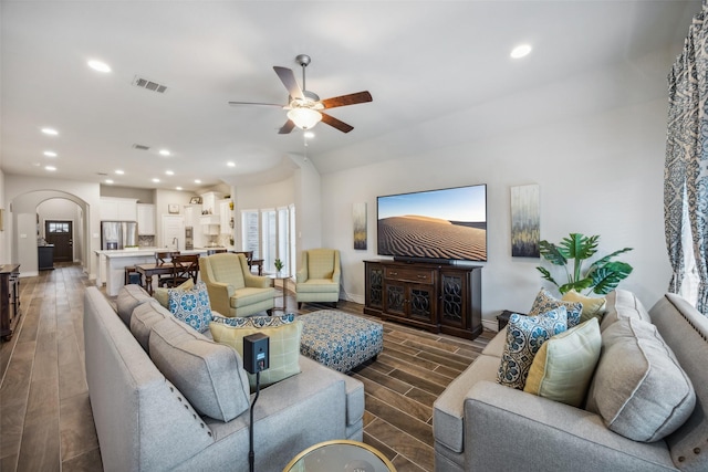 living room featuring ceiling fan