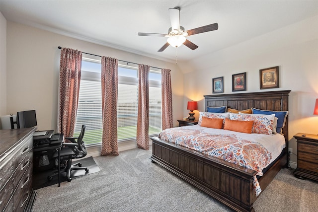 carpeted bedroom featuring ceiling fan and lofted ceiling