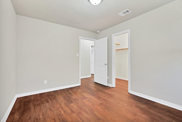 unfurnished room featuring dark hardwood / wood-style flooring