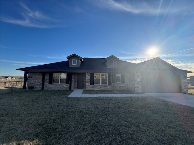 view of front of home featuring a garage and a front yard