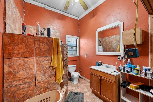 bathroom with tile patterned floors, ornamental molding, vanity, ceiling fan, and toilet