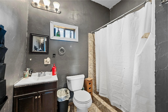 bathroom with vanity, a shower with shower curtain, and toilet