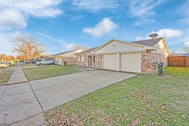 ranch-style home featuring a front lawn and a garage