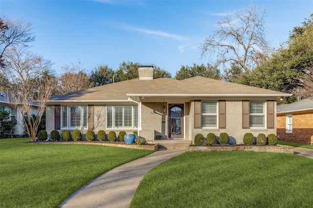 single story home featuring a front yard