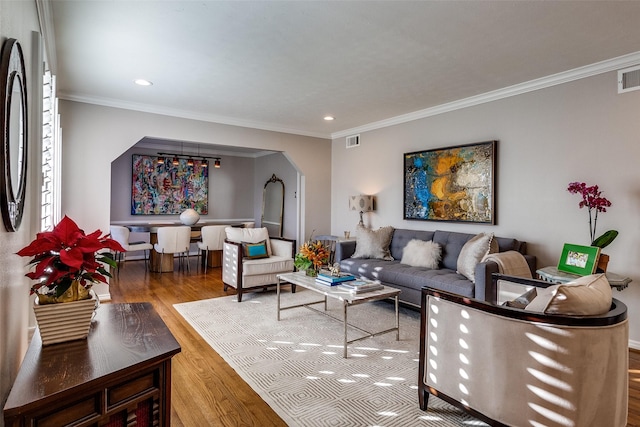 living room featuring ornamental molding and hardwood / wood-style flooring