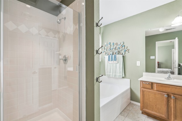 bathroom with independent shower and bath, tile patterned flooring, and vanity