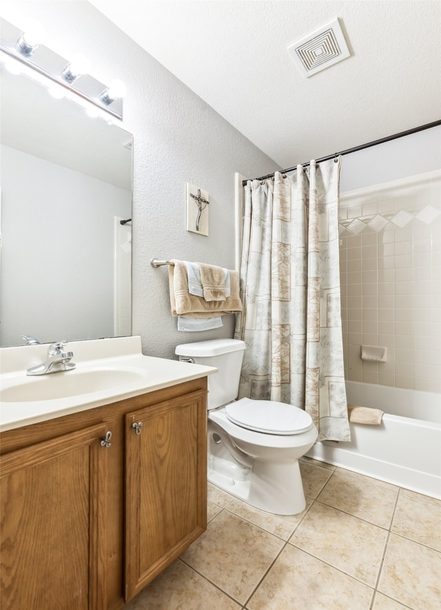 full bathroom featuring a textured ceiling, tile patterned flooring, toilet, shower / bath combination with curtain, and vanity