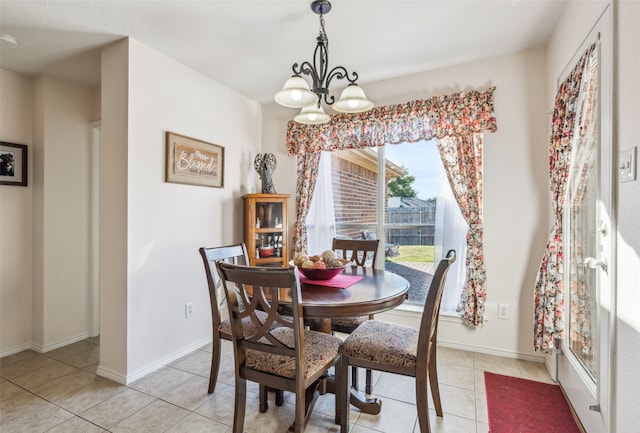 dining room with light tile patterned floors and a notable chandelier