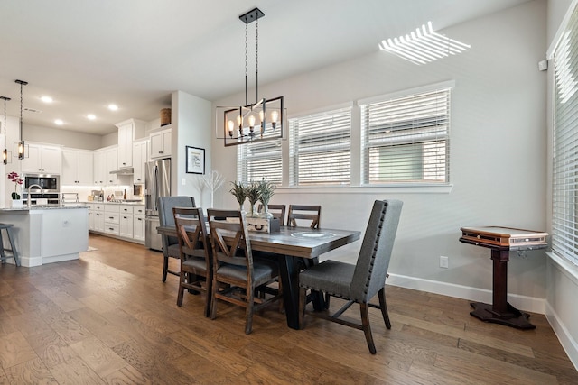 dining area with dark hardwood / wood-style floors