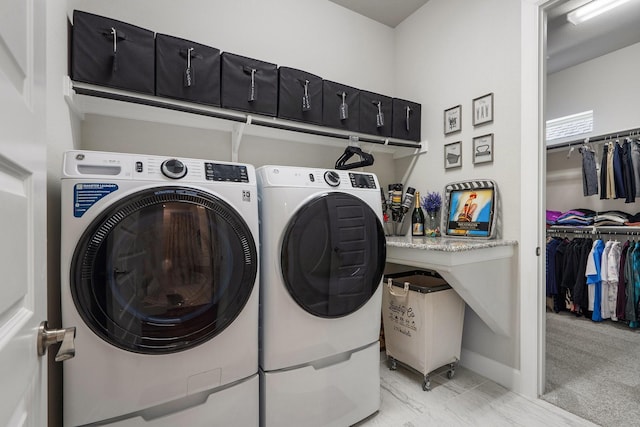 washroom featuring independent washer and dryer and light colored carpet