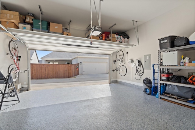 garage featuring a garage door opener and electric panel