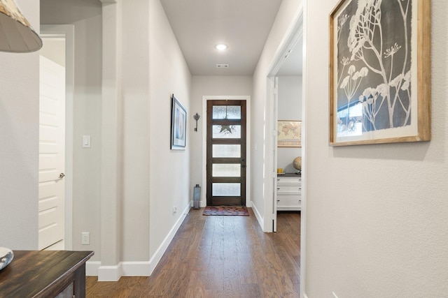 foyer entrance with dark wood-type flooring