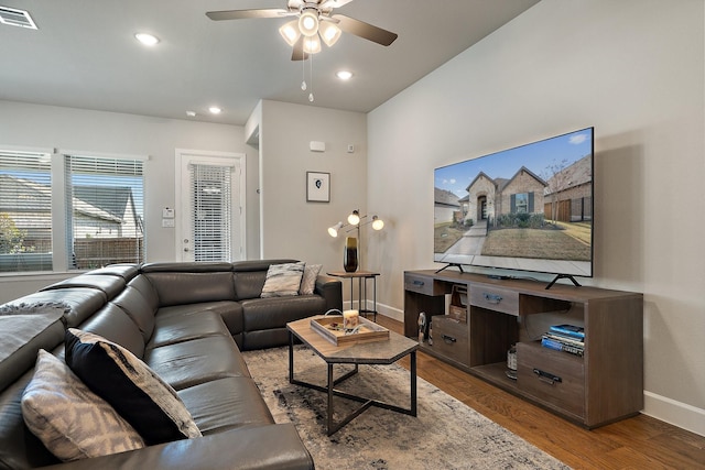 living room featuring ceiling fan and hardwood / wood-style floors