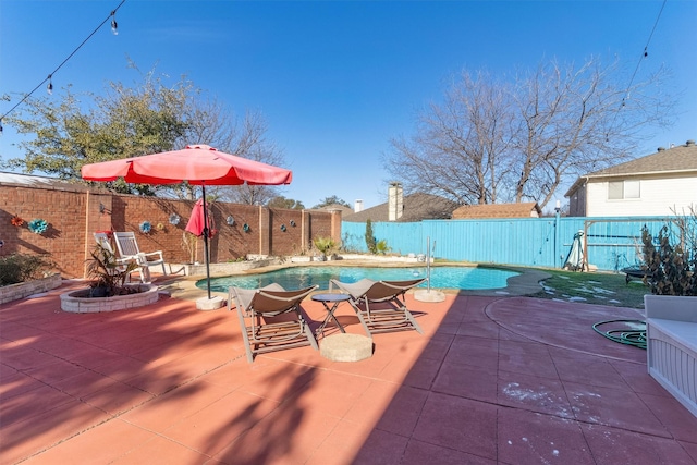 view of swimming pool with a patio