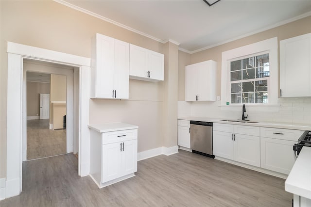 kitchen with sink, stainless steel appliances, and white cabinetry