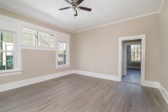 unfurnished room with ceiling fan, ornamental molding, and hardwood / wood-style floors