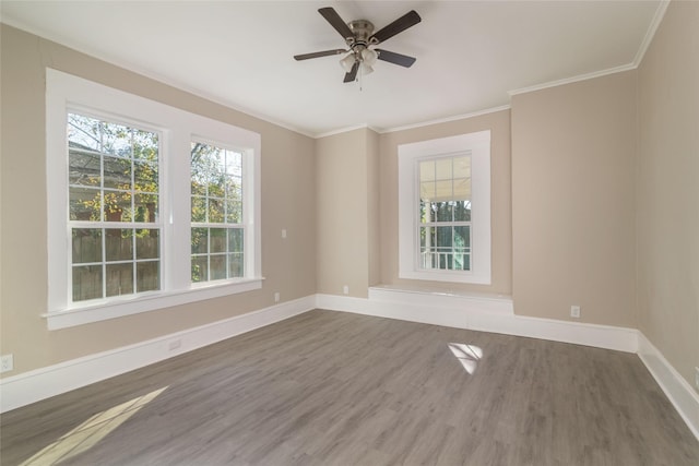 unfurnished room featuring ornamental molding, ceiling fan, and wood-type flooring