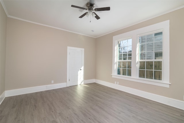 unfurnished room with ceiling fan, hardwood / wood-style flooring, and ornamental molding