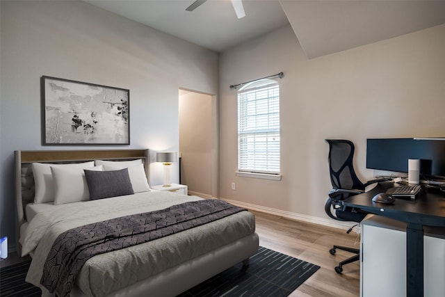 bedroom with wood finished floors, baseboards, and ceiling fan