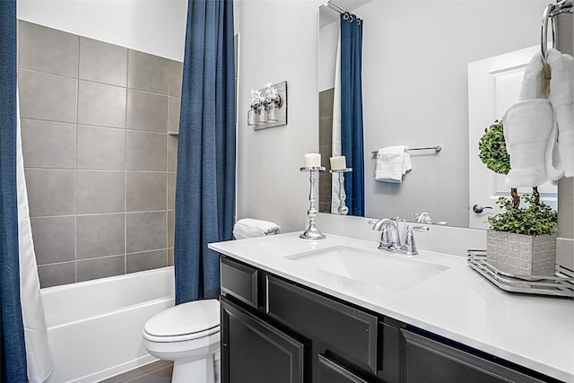 bathroom with vanity, shower / tub combo, toilet, and wood finished floors