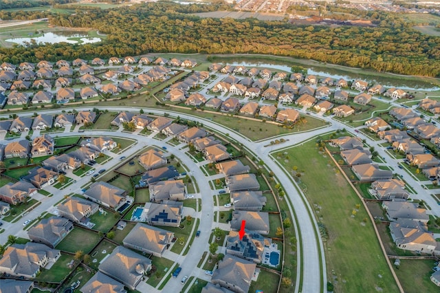 drone / aerial view with a residential view and a water view