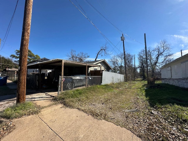 view of side of home featuring a carport