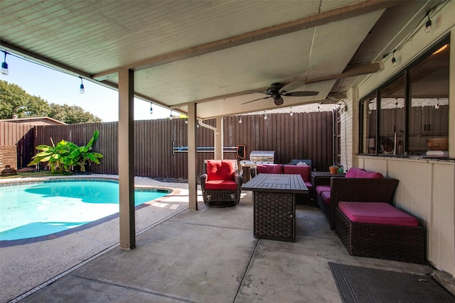 view of swimming pool featuring ceiling fan, a patio area, and outdoor lounge area