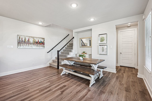 dining area with dark hardwood / wood-style flooring