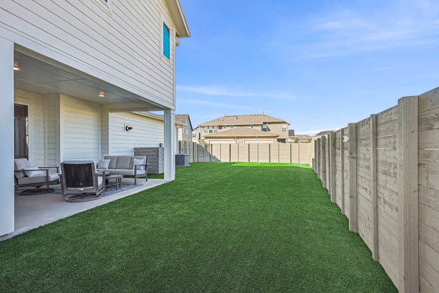 view of yard featuring a patio, central air condition unit, and outdoor lounge area