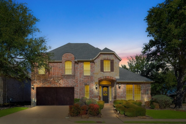 french country home with a garage