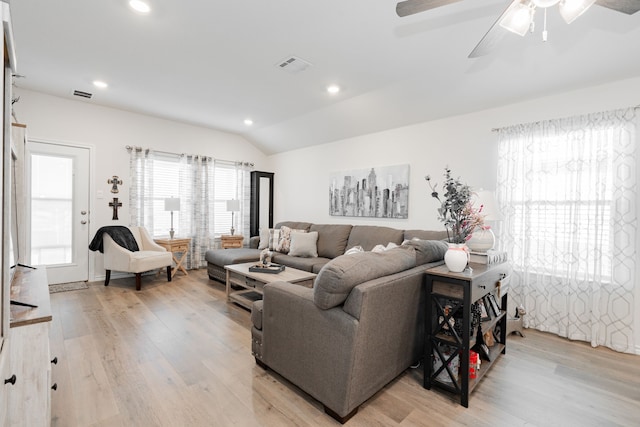 living room with vaulted ceiling, ceiling fan, and light hardwood / wood-style floors