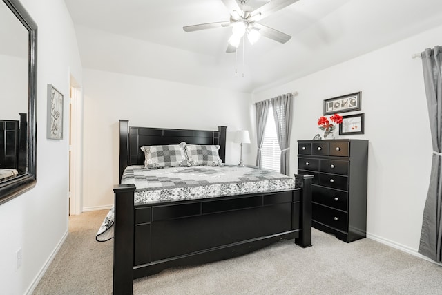 bedroom with ceiling fan and light colored carpet