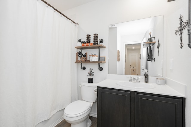 full bathroom with toilet, vanity, and shower / bath combination with curtain