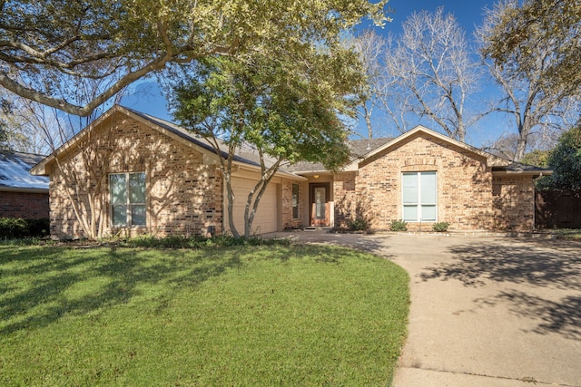 ranch-style house featuring a front yard and a garage