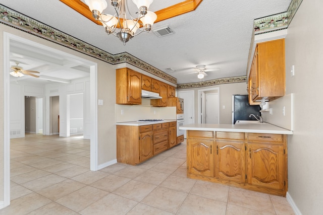 kitchen featuring ceiling fan with notable chandelier, light tile patterned floors, pendant lighting, and white oven