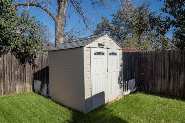 view of outbuilding featuring a yard