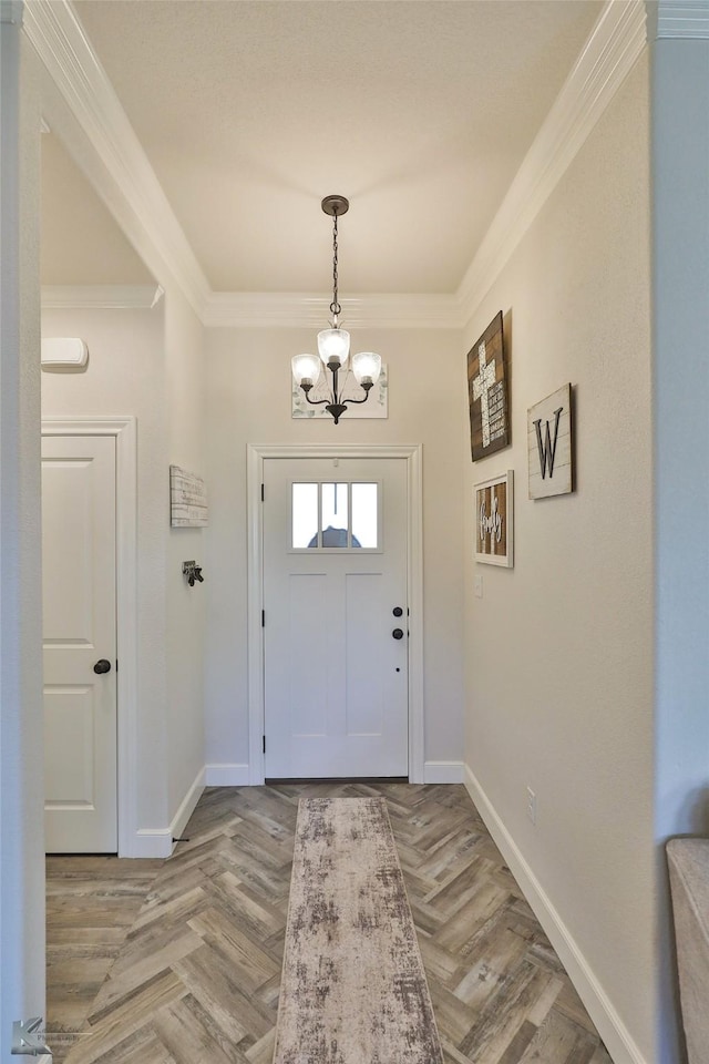 entryway featuring crown molding, light parquet floors, and a notable chandelier