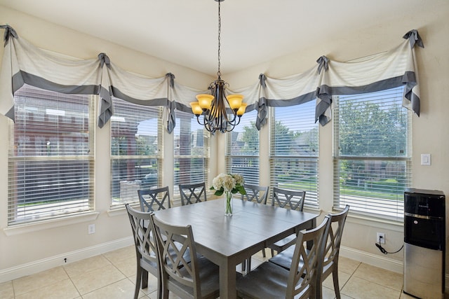 tiled dining room with an inviting chandelier and a wealth of natural light