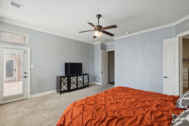 carpeted bedroom featuring ceiling fan and crown molding