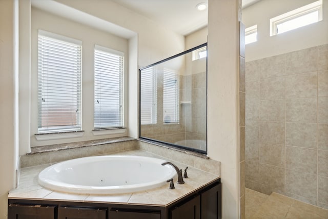 bathroom with shower with separate bathtub