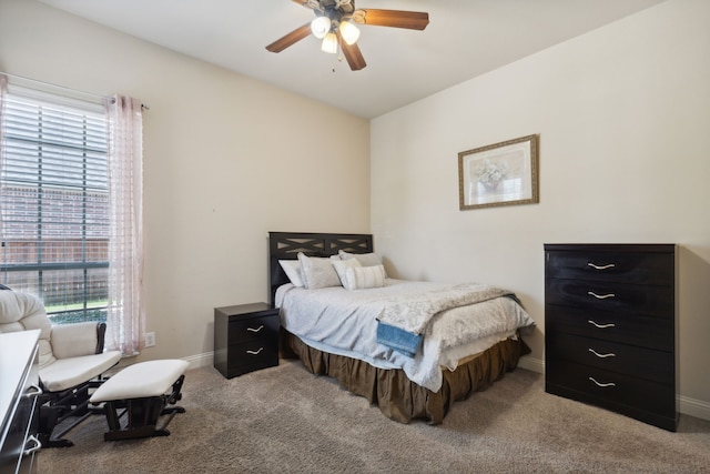 bedroom featuring light colored carpet and ceiling fan