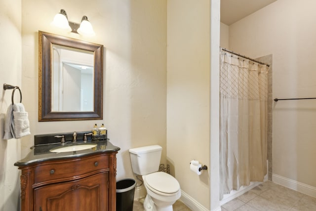 bathroom with tile patterned flooring, curtained shower, vanity, and toilet