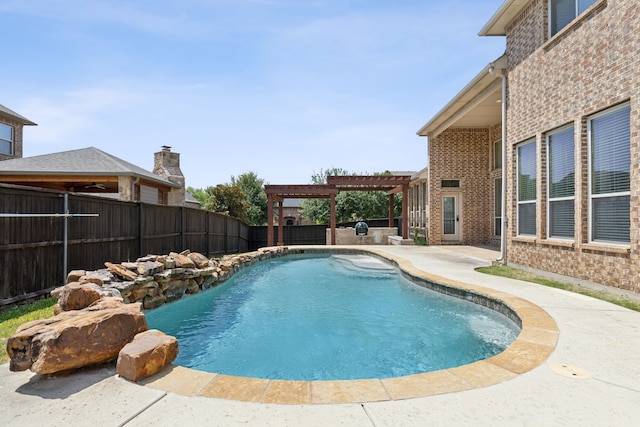 view of pool with a pergola and a patio area