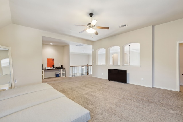 living room with lofted ceiling, carpet floors, and ceiling fan