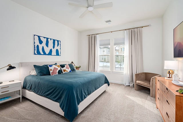 bedroom with ceiling fan and light colored carpet