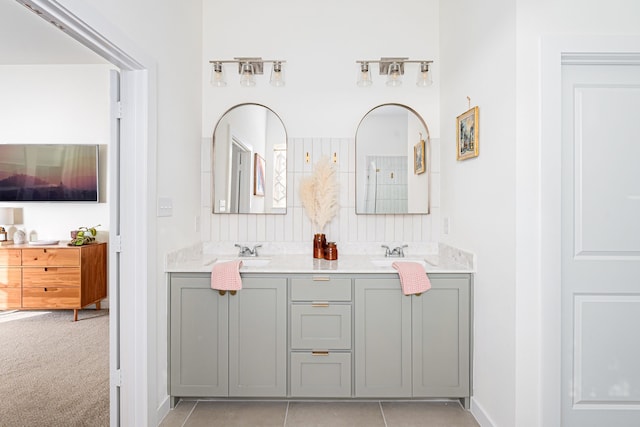 bathroom with tile patterned floors and vanity