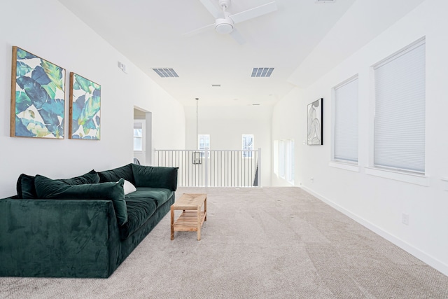 living room with ceiling fan and carpet