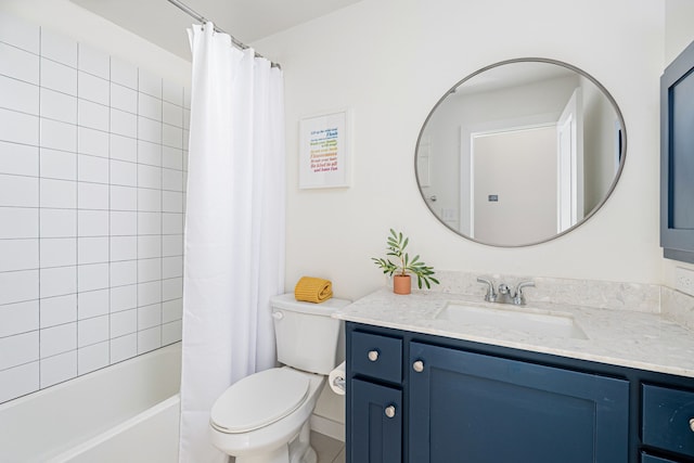 full bathroom with vanity, shower / bath combo, and toilet